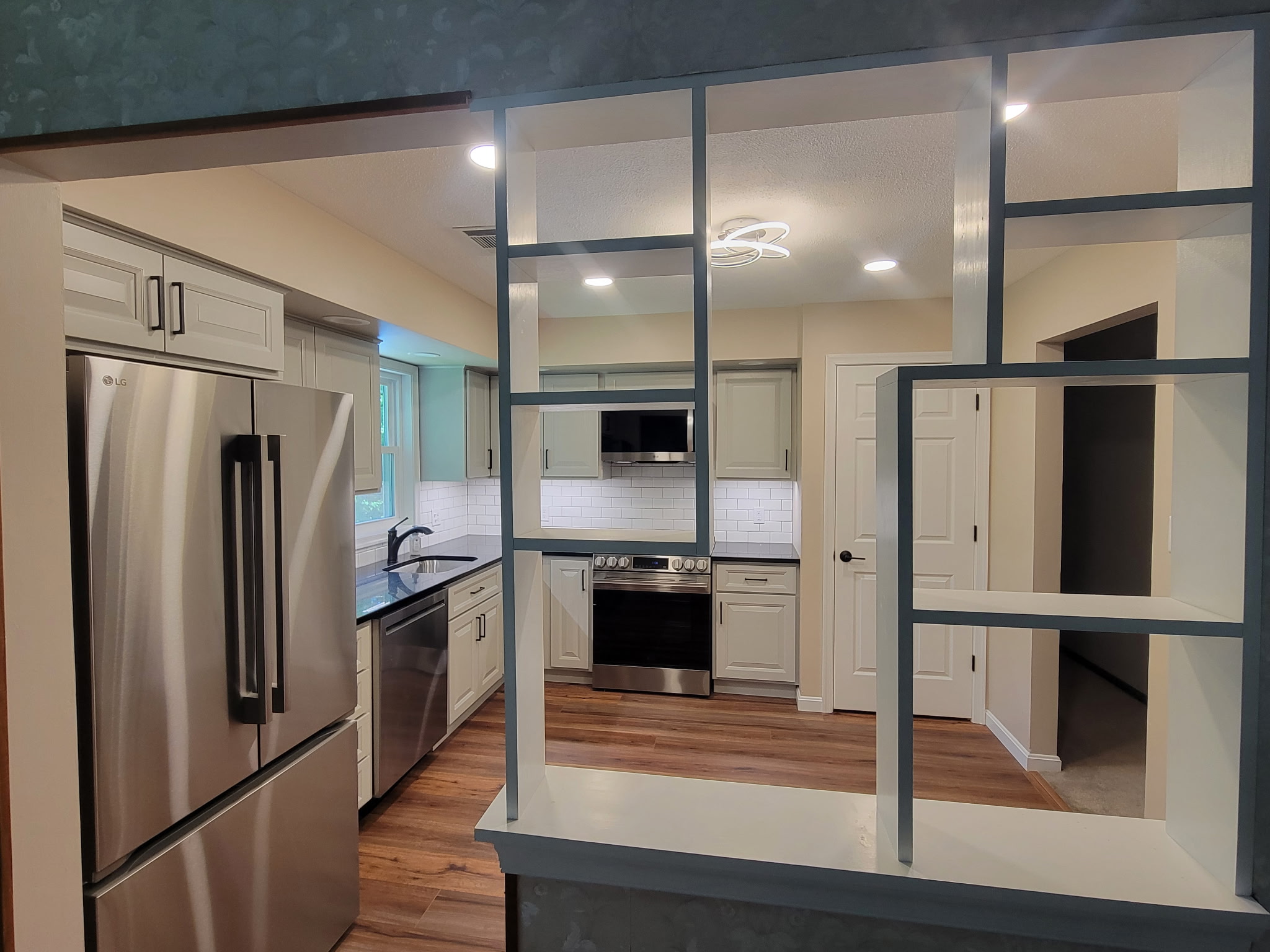 Custom shelving designed for a kitchen renovation by Jared D. Aungst Construction.
